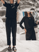 Cotton-linen set in monochrome with relaxed short-sleeve top and straight-leg pants displayed on white background