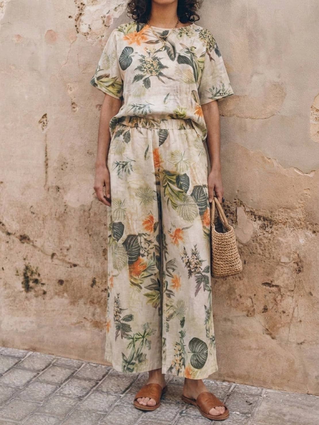 Woman wearing soft-tailored loose fit co-ord set with wide-leg bottoms in light cotton fabric