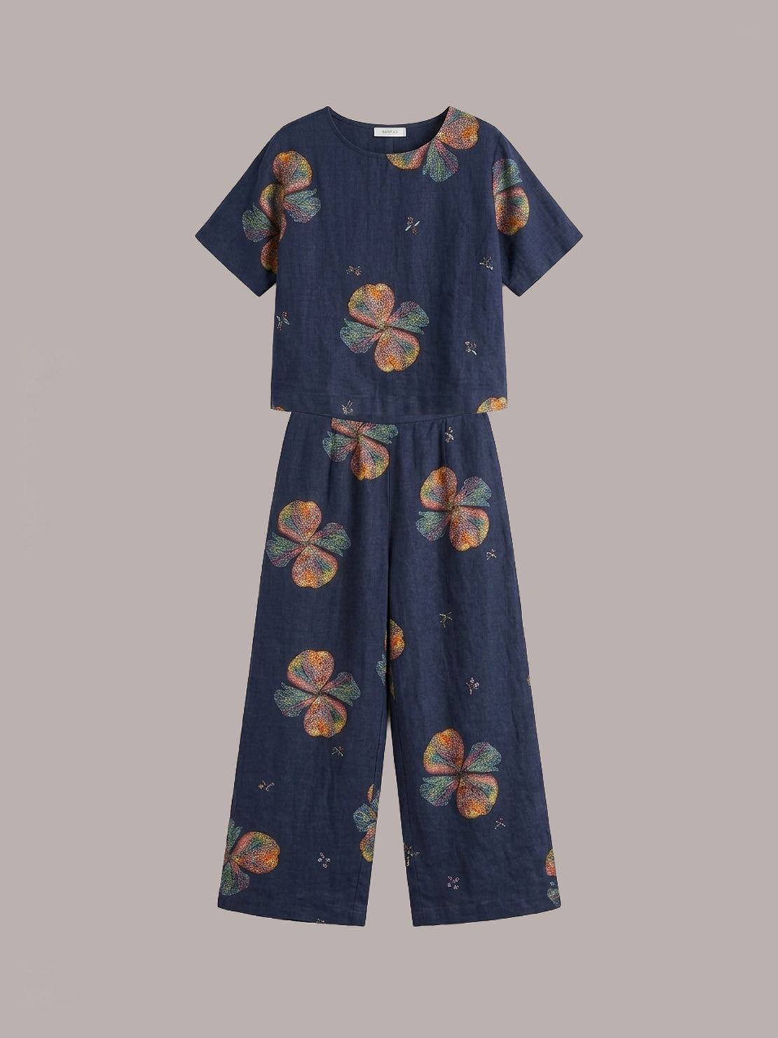 woman wearing soft-tailored loose fit co-ord set with wide-leg cotton trousers in natural light