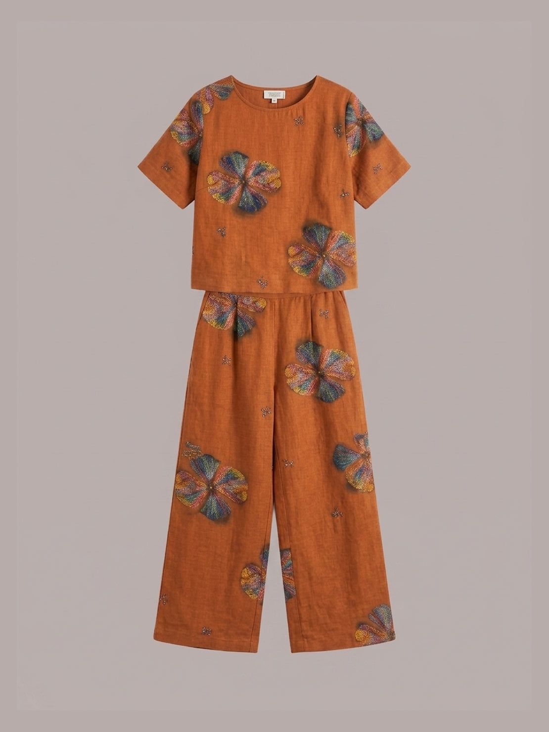 woman wearing soft-tailored loose fit co-ord set with wide-leg trousers in light beige cotton