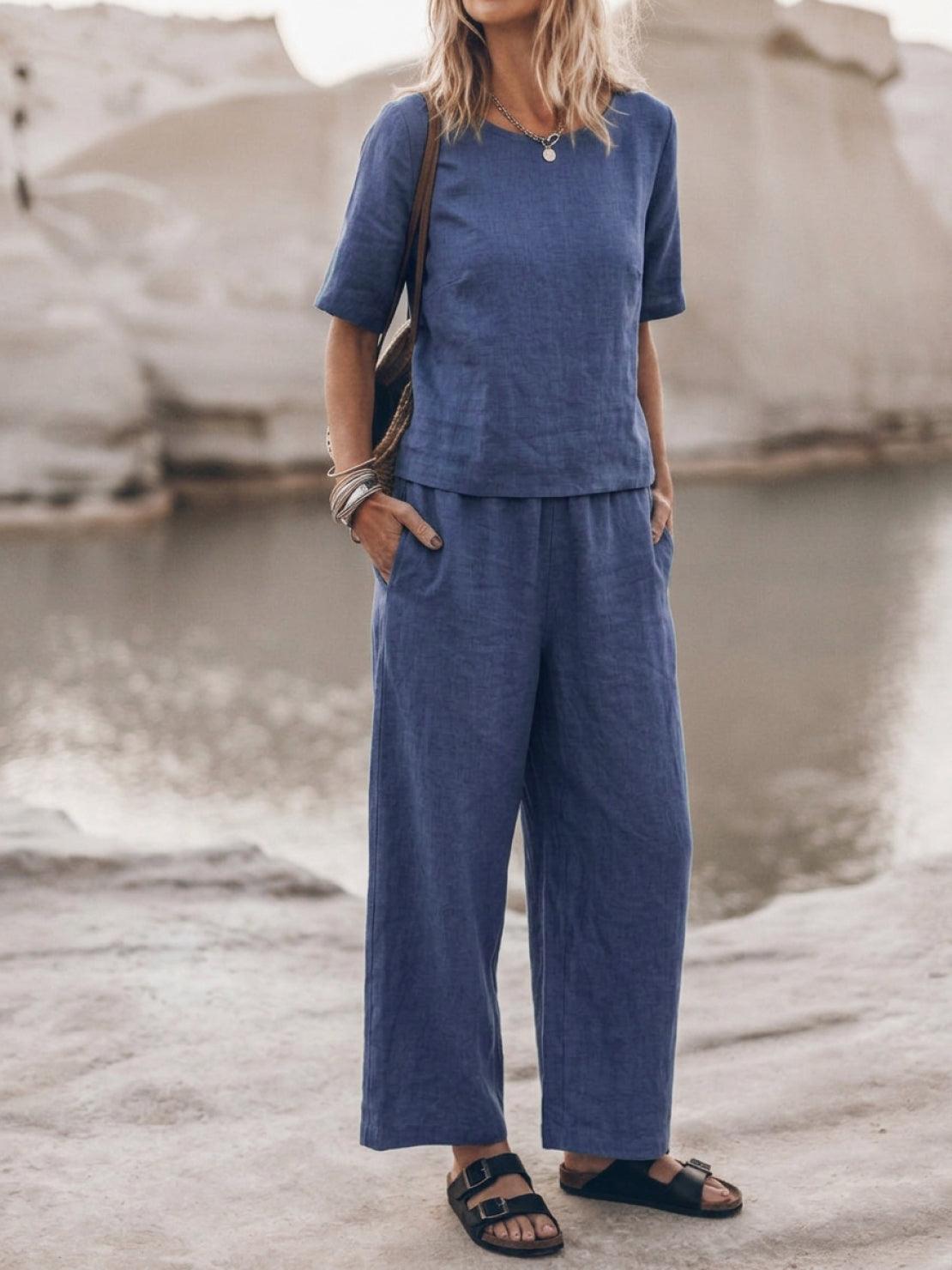 Woman wearing soft cotton loose fit co-ord set with wide-leg trousers and relaxed short-sleeve top