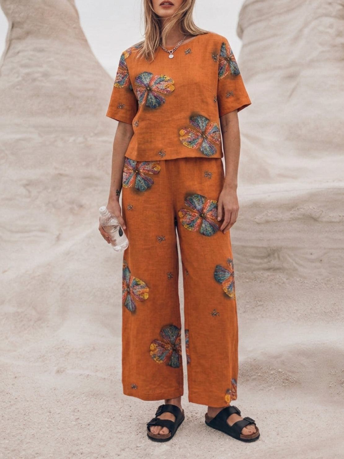 woman wearing loose fit co-ord set with soft-tailored top and wide-leg bottoms in breathable cotton