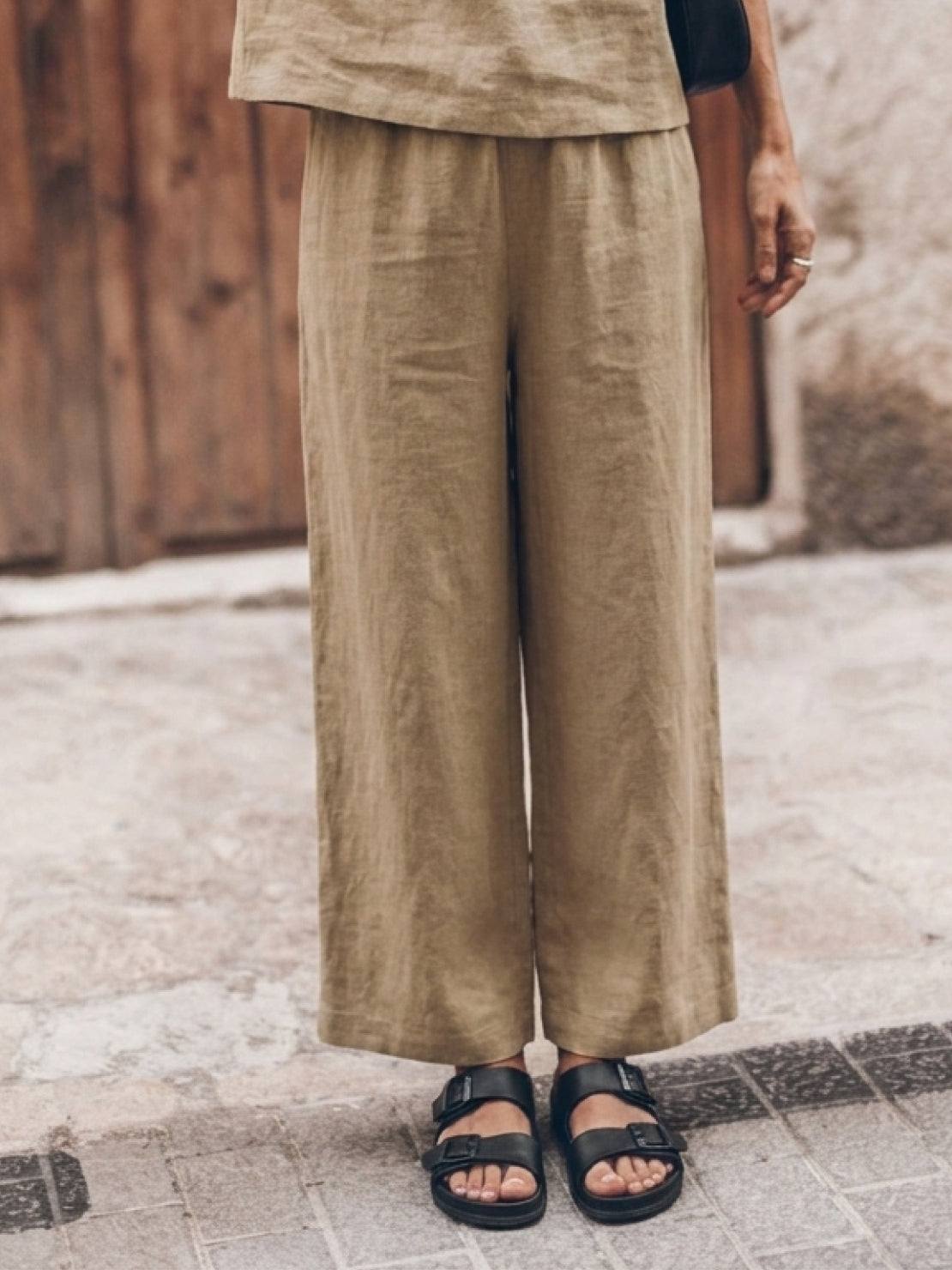 light beige loose fit co-ord set with short sleeves and wide-leg pants on white background