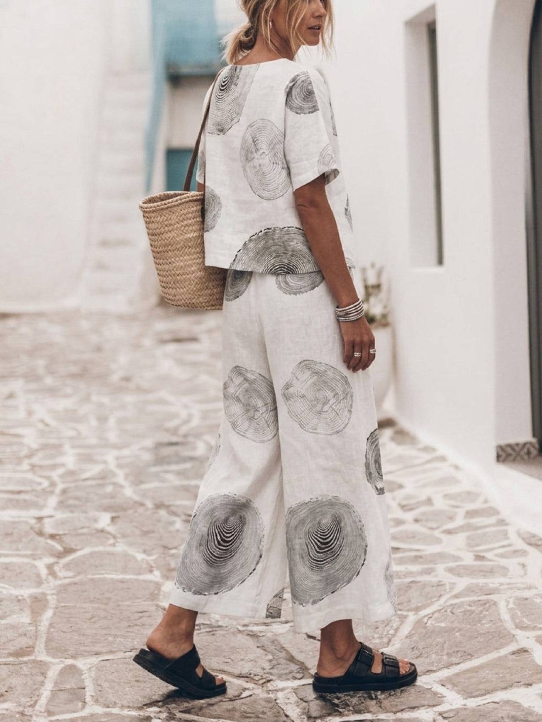 Light blue loose fit co-ord set with soft-tailored top and wide-leg cotton trousers on white background