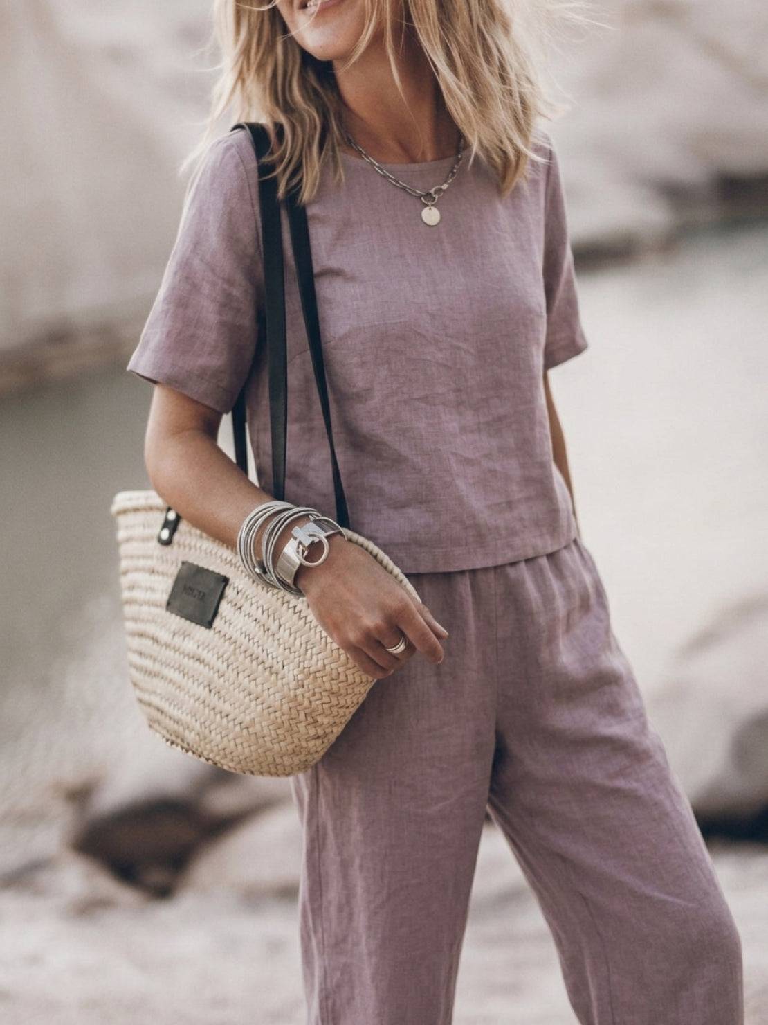 Woman wearing loose fit co-ord set with soft-tailored top and wide-leg cotton bottoms