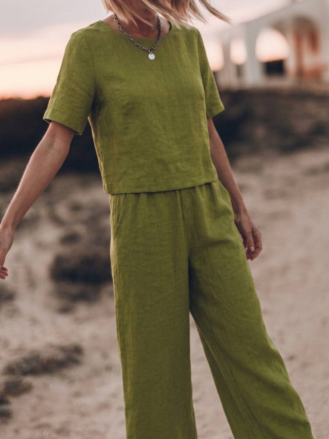woman wearing loose fit co-ord set with soft-tailored top and wide-leg bottoms