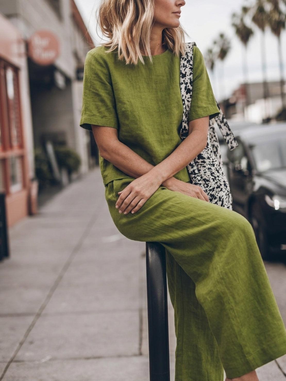woman wearing soft-tailored, loose fit co-ord set with wide short sleeves and wide-leg trousers