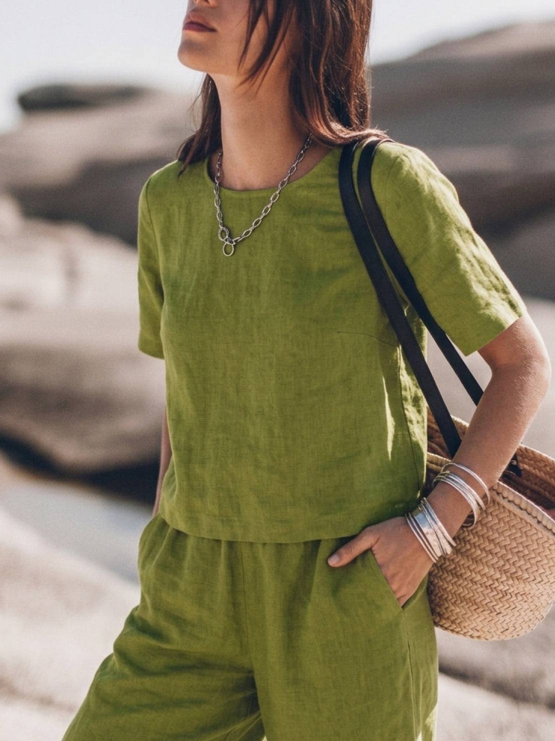 Woman wearing a soft cotton loose fit co-ord set with wide-leg trousers and short sleeves