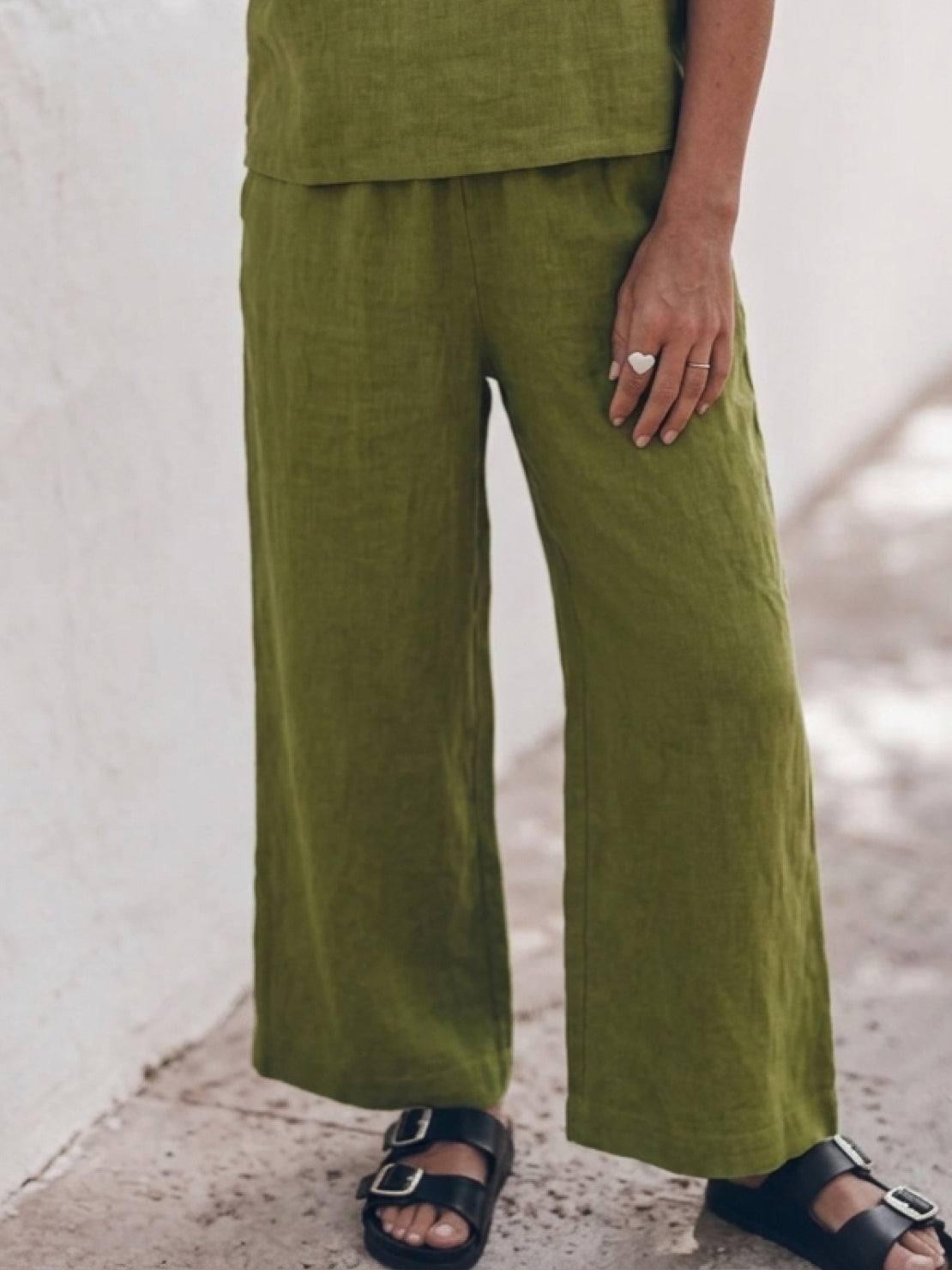 Woman wearing a soft cotton loose fit co-ord set with short sleeves and wide-leg trousers in relaxed style