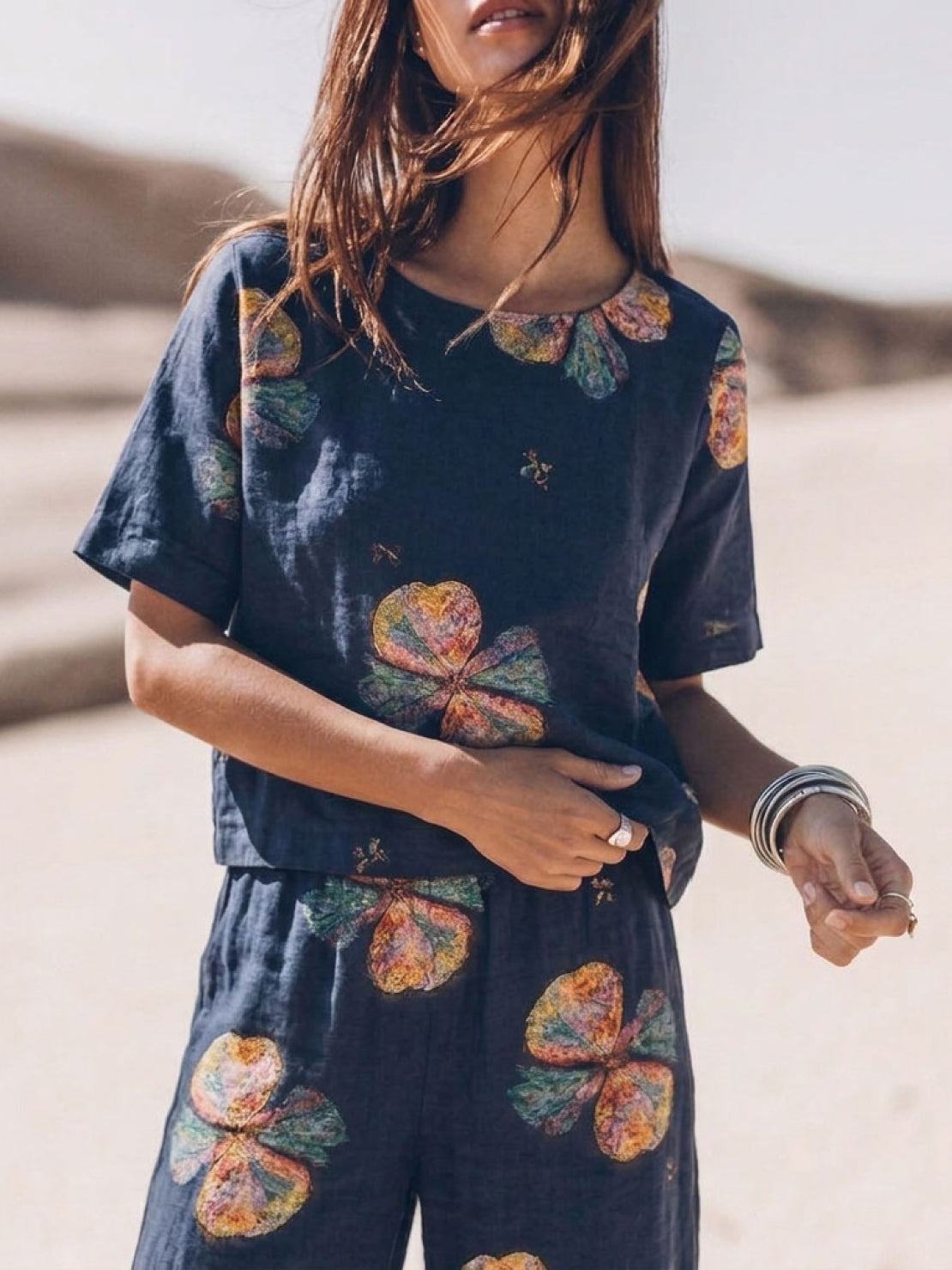 Woman wearing soft tailored loose fit co-ord set with wide-leg trousers in light cotton fabric