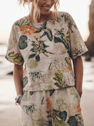 Woman wearing soft tailored loose fit co-ord set with wide-leg cotton trousers and relaxed top