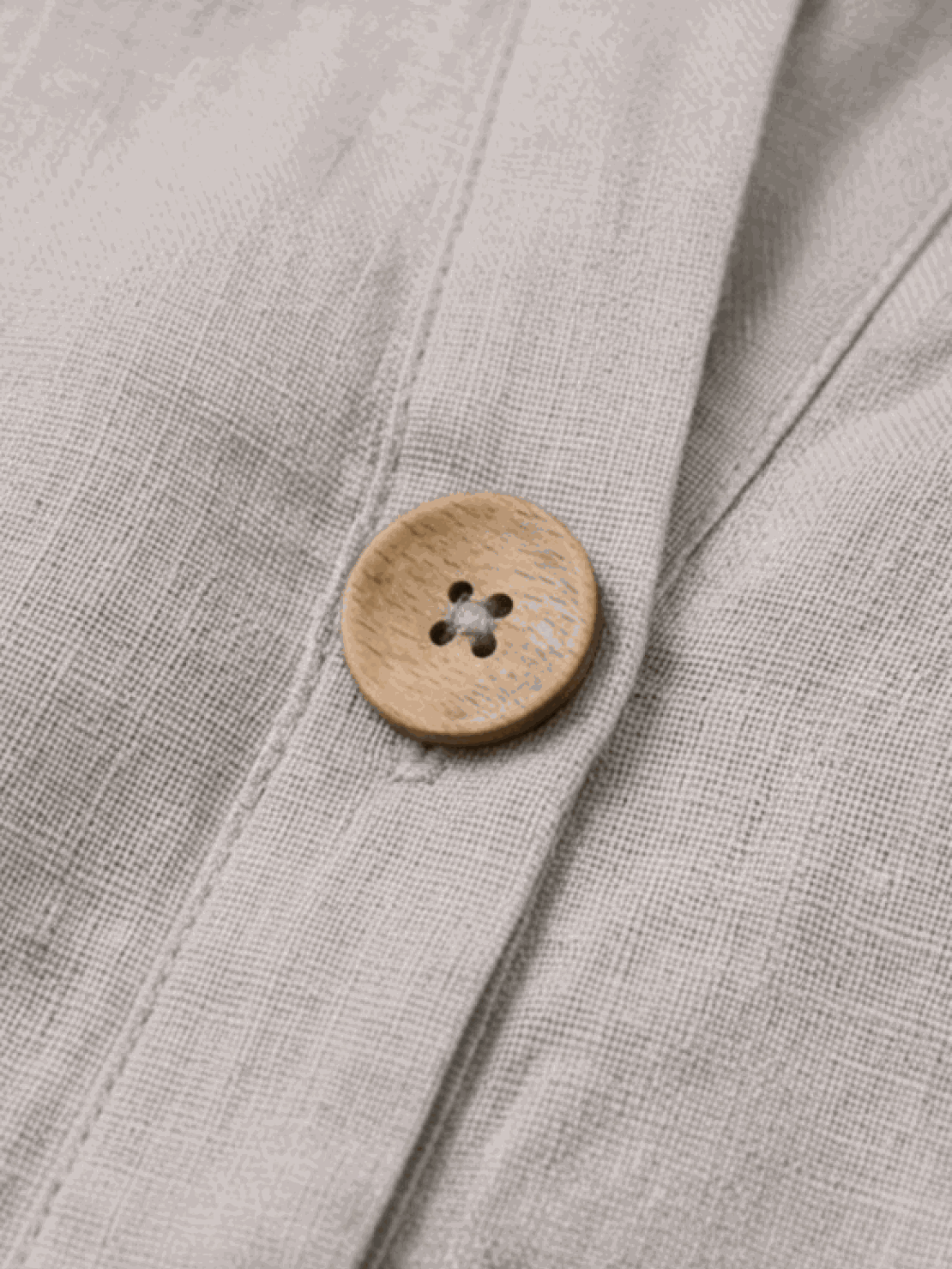 woman wearing pure linen age-defying button detail shirt in soft white