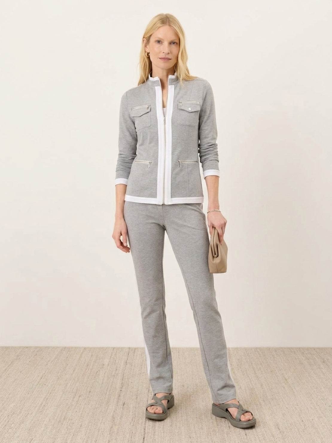 Woman wearing sleek contrast zip two-piece outfit with soft stretch fabric and flattering silhouette