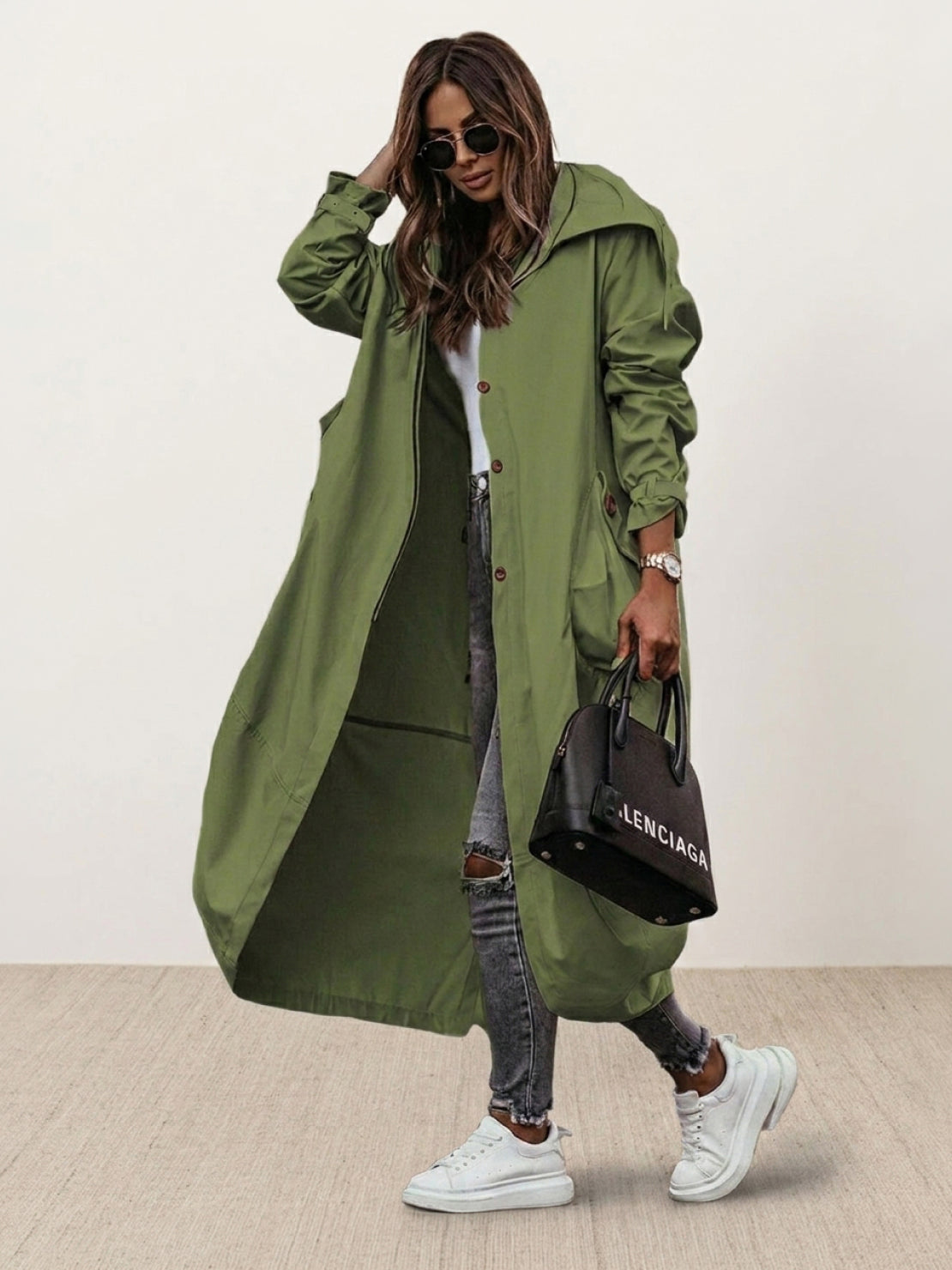 Plus size minimalist hooded coat with oversized fit for travel and layering.