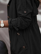 Minimalist hooded coat in oversized fit for travel and layering