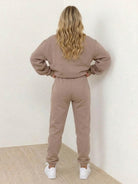 Woman wearing Classic Comfort Athleisure Set in casual pose on white background