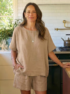 Comfy linen-like shirt and shorts two-piece set in breathable fabric for casual and versatile style