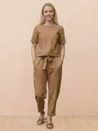 Breathable cotton linen set with relaxed short-sleeve top and straight-leg pants in monochrome tones