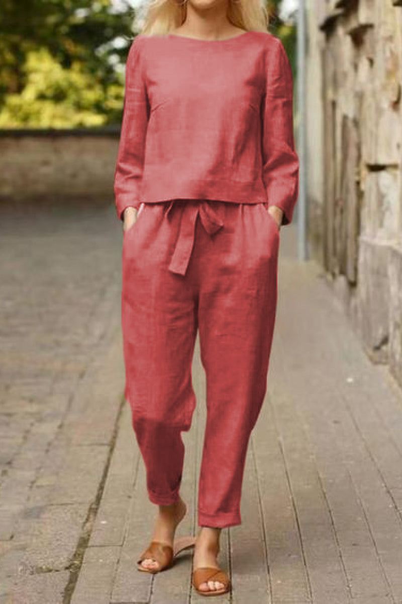 woman wearing relaxed cotton-linen monochrome capsule in red with longline top and wide-leg pants outdoors