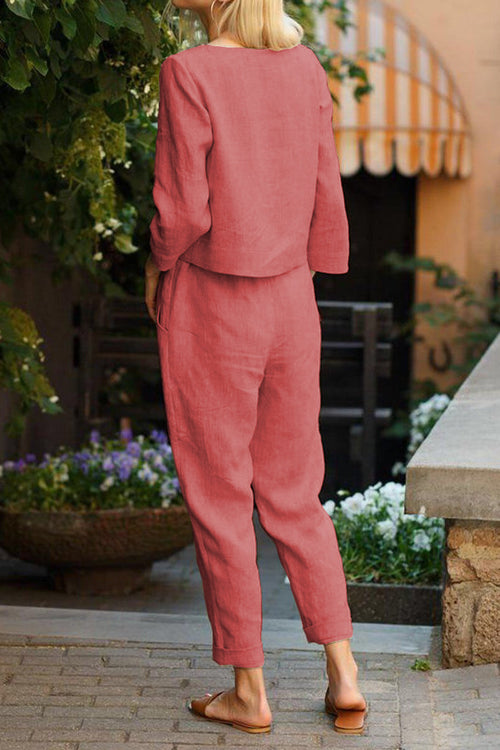 woman wearing relaxed cotton-linen monochrome longline top and wide-leg pants set walking outdoors
