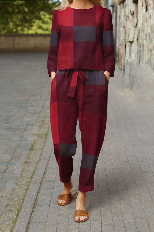 woman wearing red and black cotton-linen monochrome capsule set with long-sleeve top and wide-leg pants outdoors