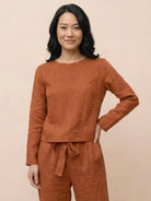 Model wearing cotton-linen monochrome relaxed longline top and wide-leg pants set