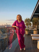 woman wearing elegant layers two-piece set with V-neck and layered top in light fabric