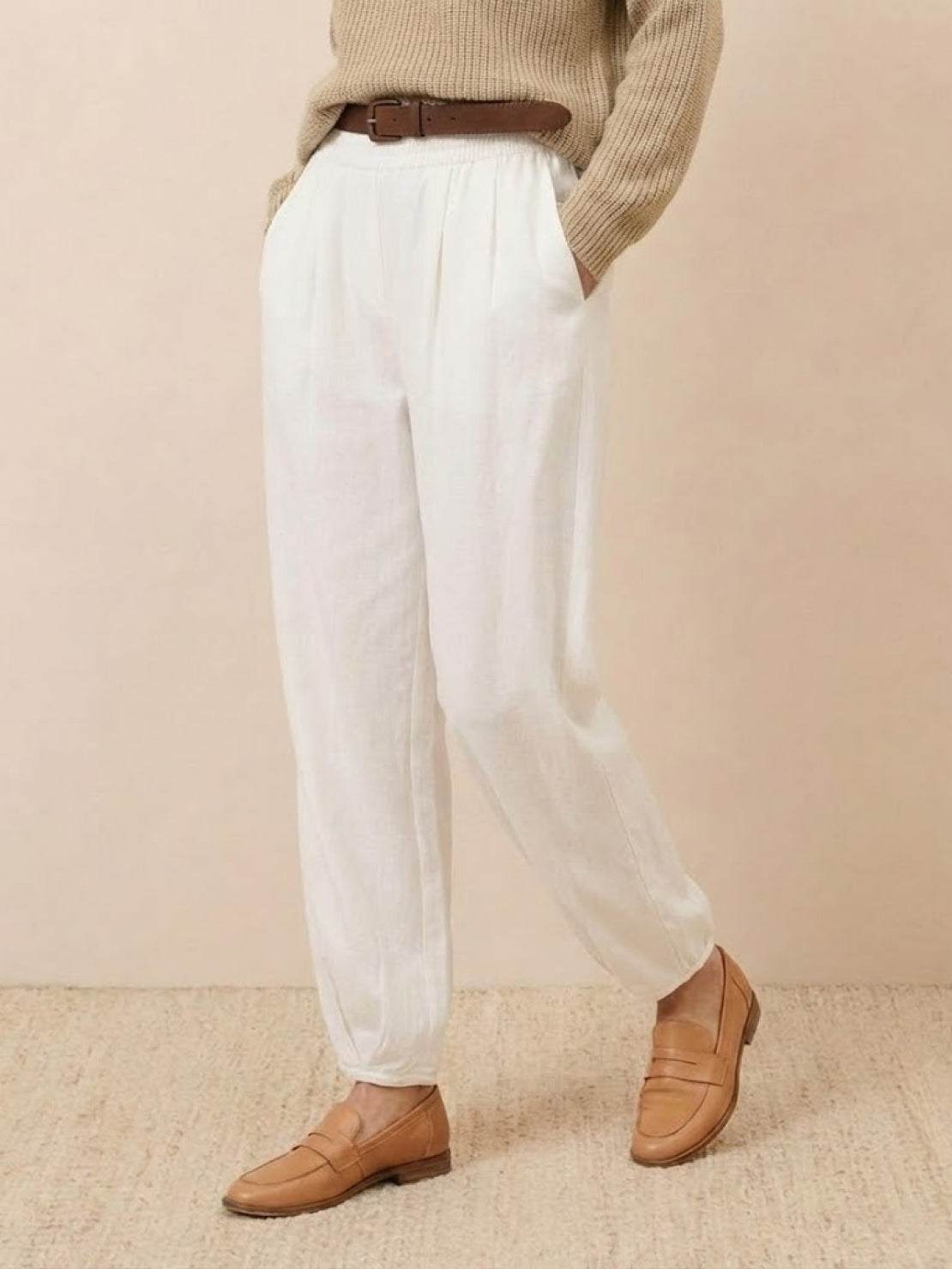 European minimalism white relaxed trousers with brown belt and loafers