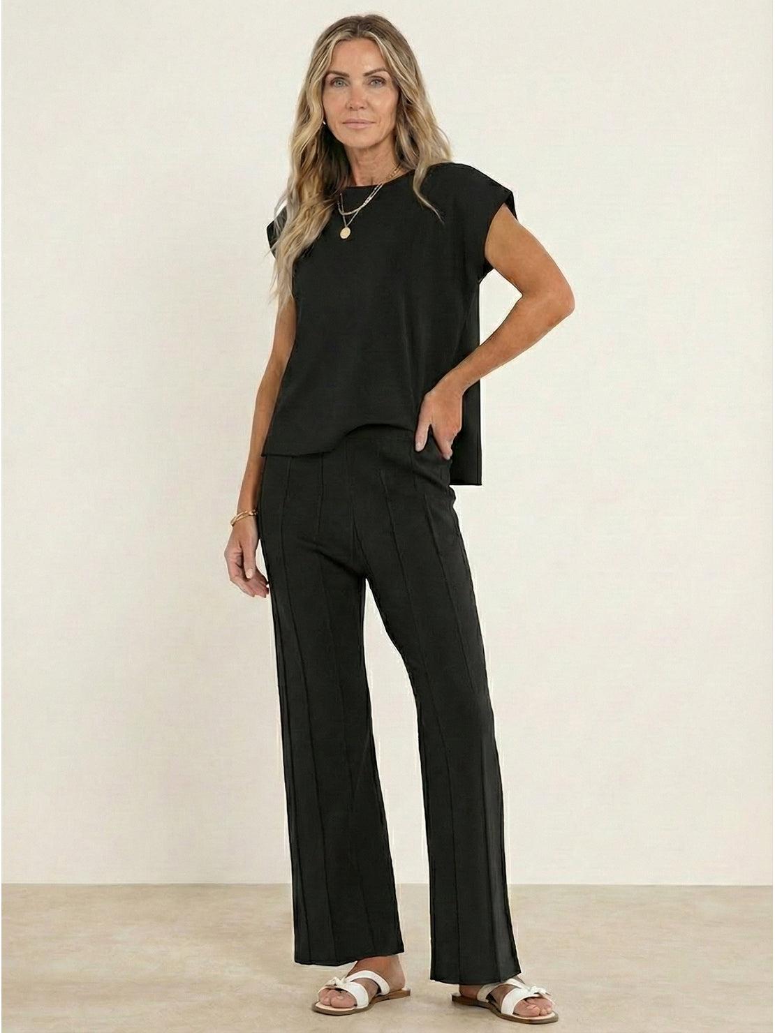 First Class Travel two-piece set in soft viscose-acrylic blend with pleated wide-leg pants and matching top for wrinkle-resistant, versatile comfort