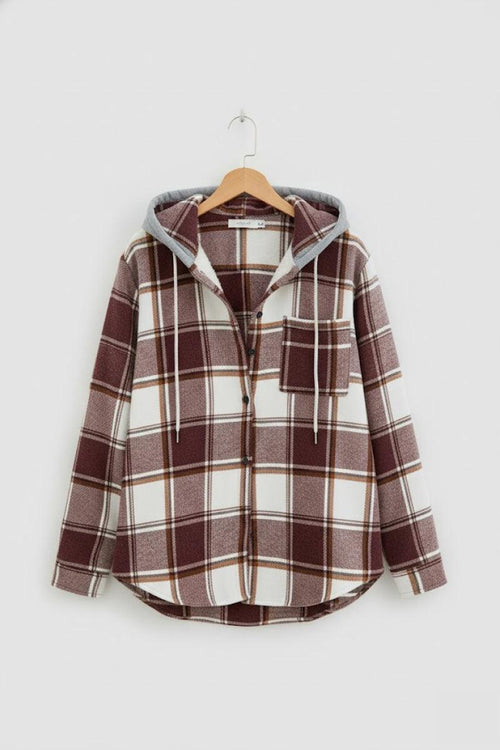 Highland Plaid Shacket with brown and white check pattern, soft fleece lining, button-front closure, and attached hood for casual layering.