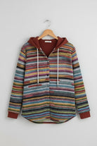 Highland Plaid Shacket with multicolor stripes, attached hood, button-front, and fleece lining, cozy and versatile layering piece for cool weather.