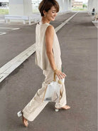 Loose solid color sleeveless two-piece set with oversized fit and breathable cotton blend fabric