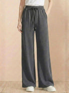 Wide-leg lyocell-blend fleece pants with elastic waist and drawstring.