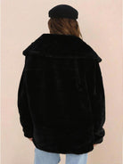 Black open front oversized faux fur jacket with draped shawl collar, mid-hip length, and relaxed fit shown from back.