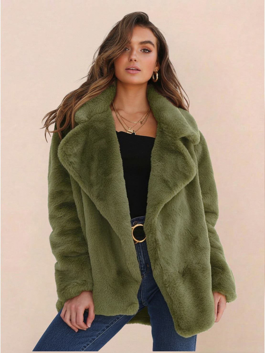 Woman wearing green open front oversized faux fur jacket with draped shawl collar and mid-hip length.