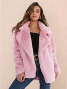 Open front oversized pink faux fur jacket with draped shawl collar and relaxed fit worn by woman