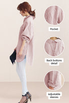 Woman wearing oversized linen shirt in sun-washed pink with back button detail and adjustable sleeves