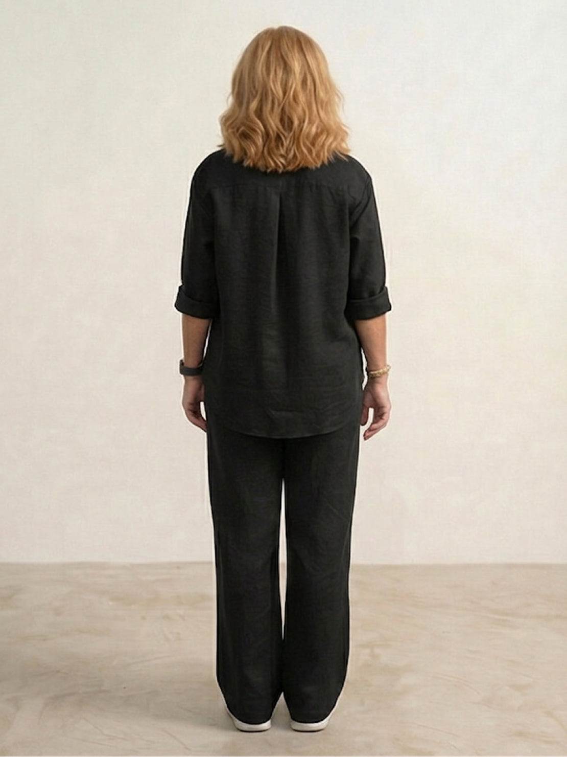 Model wearing an oversized 100% cotton shirt with wide-leg pants co-ord set in relaxed style