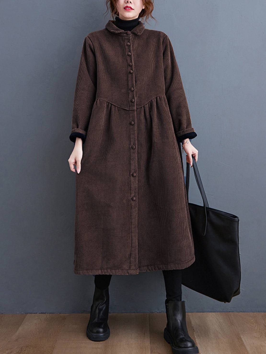 Oversized vintage corduroy coat in warm earth tones with thick texture and deep pockets for cold weather layering