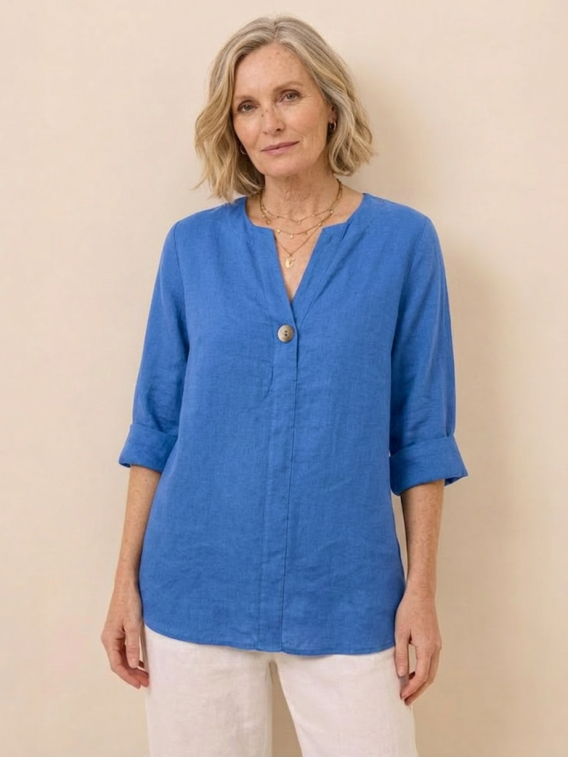 white pure linen age-defying shirt with button details on a mannequin