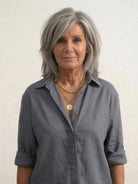 Woman wearing relaxed shirt and trousers two-piece set, soft breathable fabric, stylish casual outfit