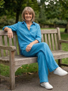 Model wearing oversized 100 cotton shirt and wide-leg pants co-ord set in relaxed style