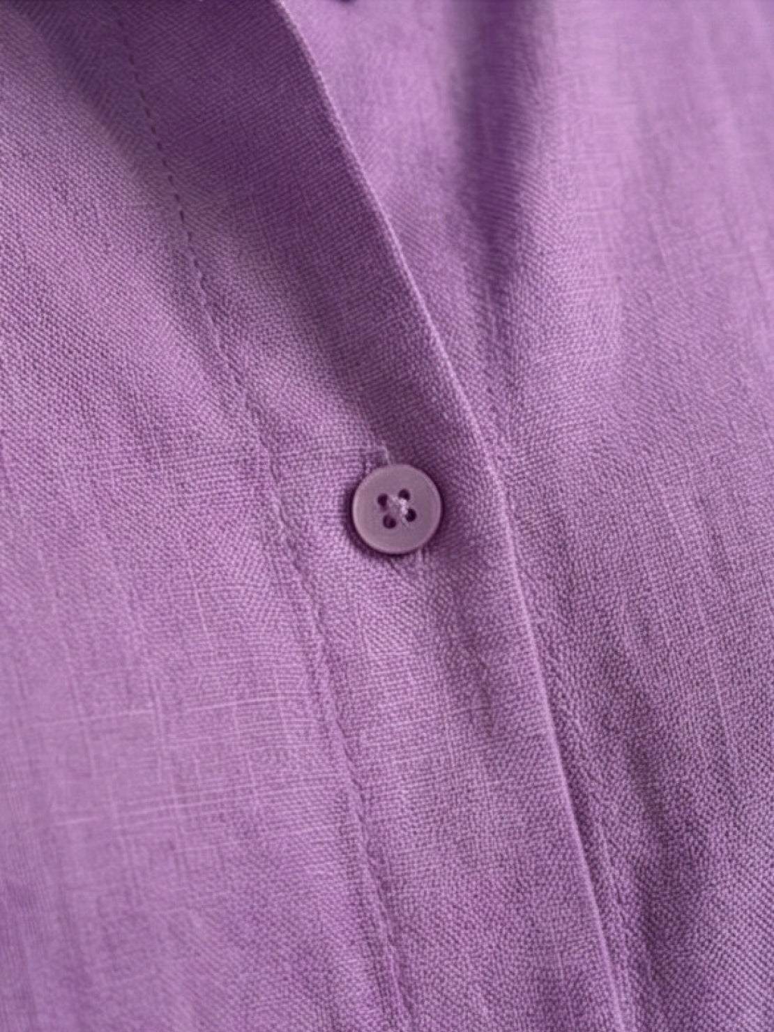 Monochrome relaxed shirt and trousers two-piece set on model standing outdoors