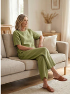 Woman wearing a soft-tailored loose fit co-ord set with wide-leg bottoms in solid color