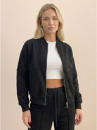 The Voyager Zip Set two-piece zip-front sweatshirt and wide-leg joggers in neutral tone for travel and casual wear