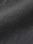 Close-up texture of dark gray cotton fabric for breathable cotton dress material