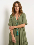 V-neck two-tiered maxi swing dress in flowy cotton fabric with an irregular hemline and loose sleeves